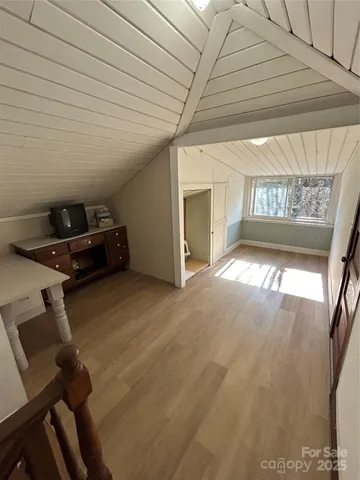 a view of an empty room and a window