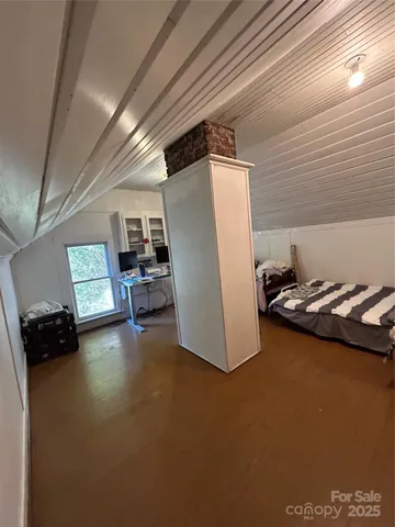 a view of a livingroom with furniture and a window