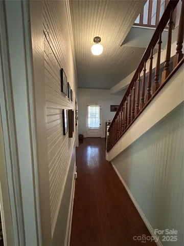 a view of staircase with lots of wooden floor