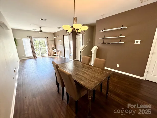 a view of a dining room with furniture and window