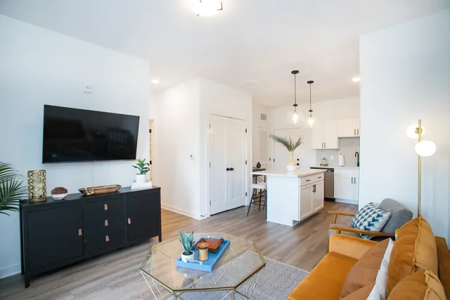 a living room with furniture and a flat screen tv