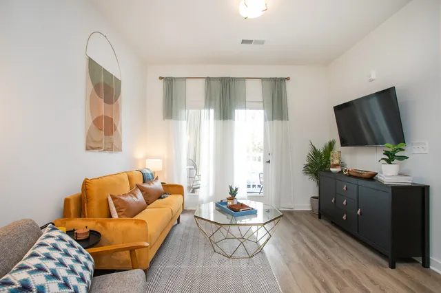 a living room with furniture and a flat screen tv