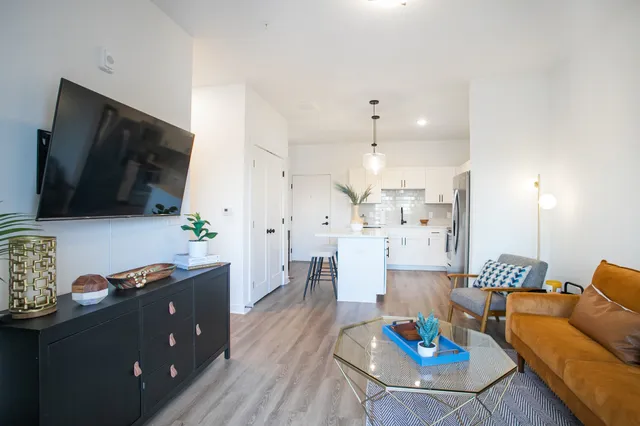 a living room with furniture and a flat screen tv