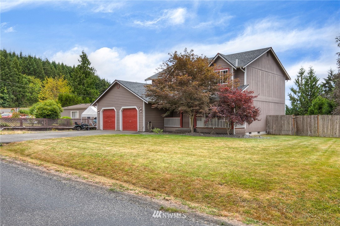 2516 Harts Lake Road South Roy, WA 98580 - Photo 3 of 32 a view of a house with a yard and garage