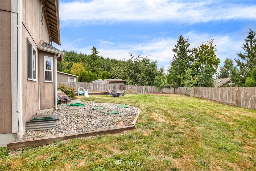 2516 Harts Lake Road South Roy, WA 98580 - Photo 25 of 32 a view of a house with backyard and sitting area