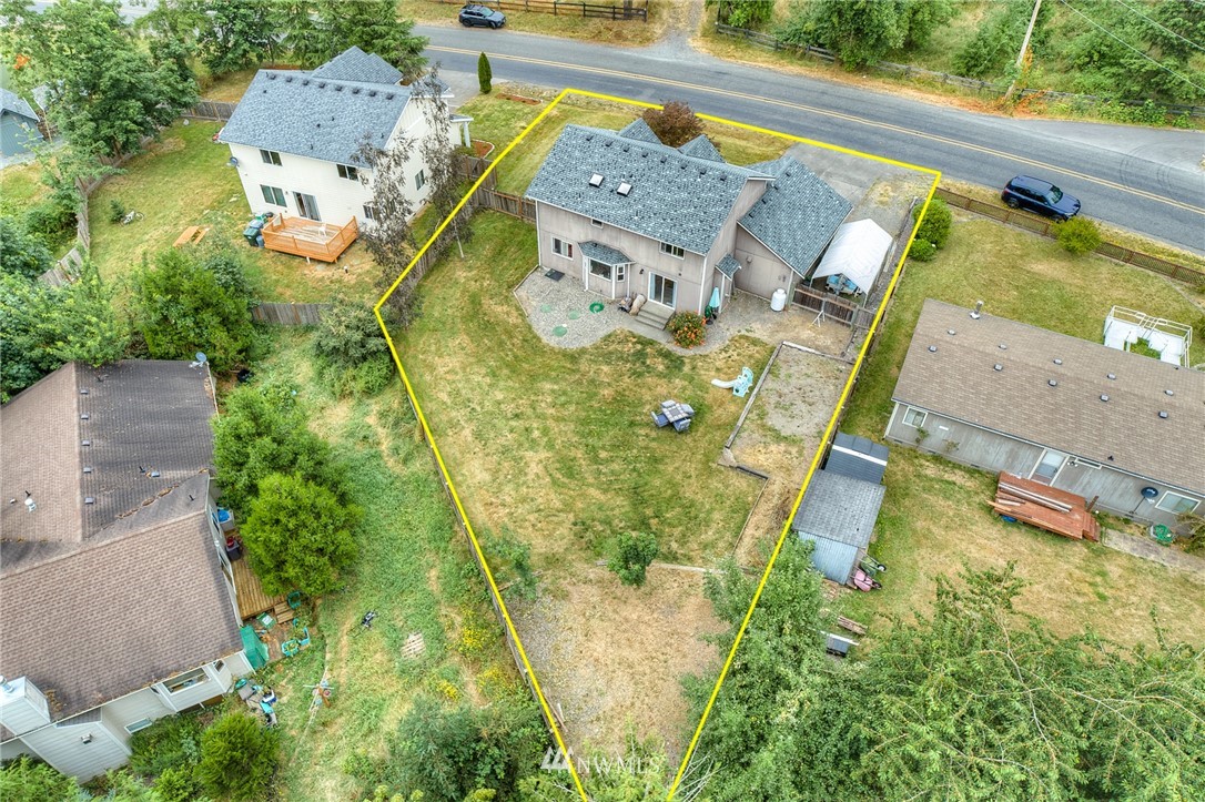2516 Harts Lake Road South Roy, WA 98580 - Photo 28 of 32 an aerial view of a house with a swimming pool