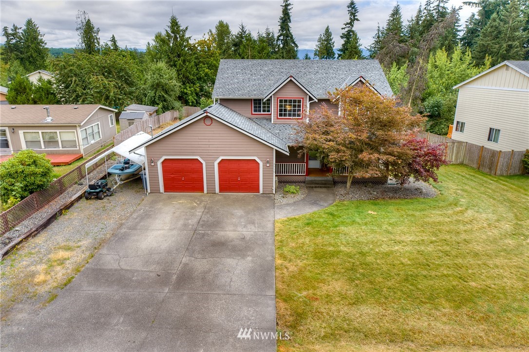 2516 Harts Lake Road South Roy, WA 98580 - Photo 30 of 32 a view of a house with a yard and sitting area