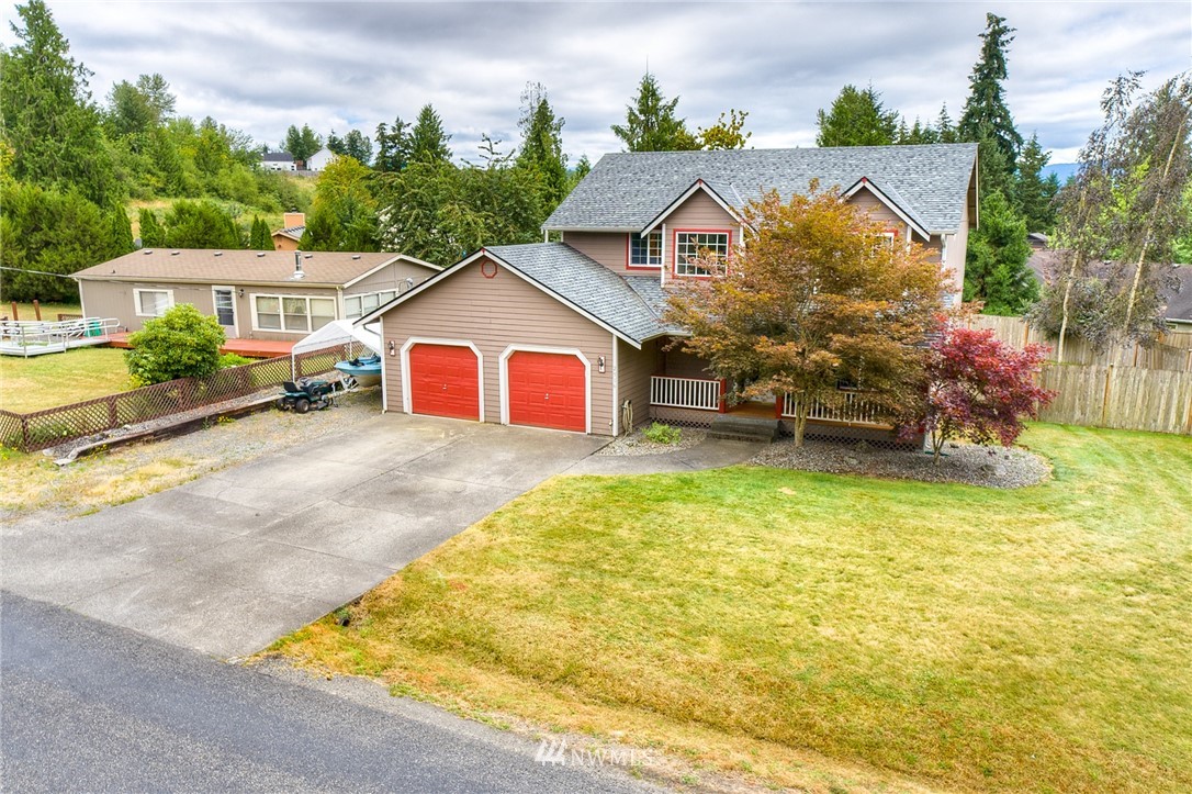2516 Harts Lake Road South Roy, WA 98580 - Photo 31 of 32 a view of a house with a swimming pool