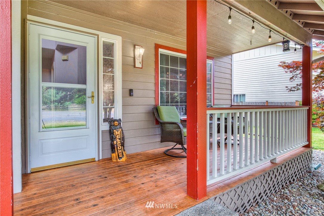 2516 Harts Lake Road South Roy, WA 98580 - Photo 5 of 32 a view of a porch with a door and wooden floor
