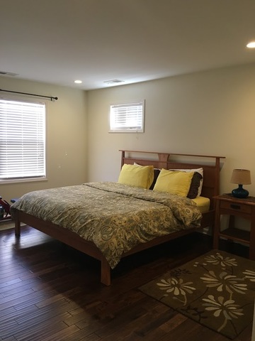 410 Raymond Road Buffalo Grove, IL 60089 - Photo 13 of 18 a bedroom with a bed and wooden floor