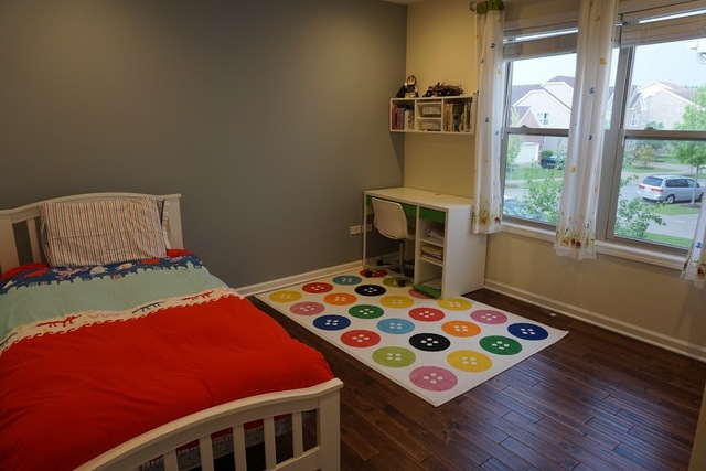 410 Raymond Road Buffalo Grove, IL 60089 - Photo 14 of 18 a bedroom with bed and a window