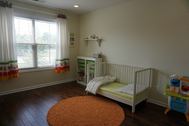 410 Raymond Road Buffalo Grove, IL 60089 - Photo 15 of 18 a bedroom with furniture and a window