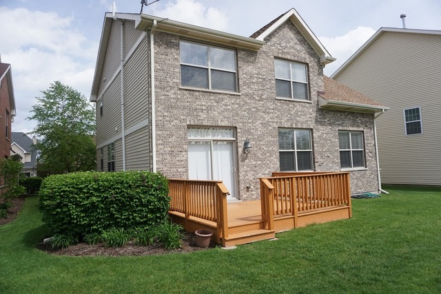 410 Raymond Road Buffalo Grove, IL 60089 - Photo 17 of 18 a front view of a house with garden