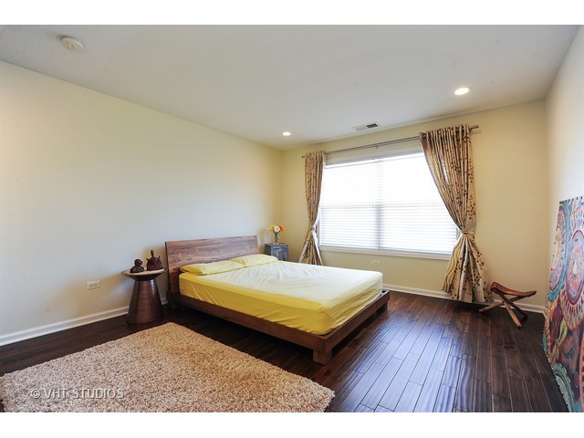 410 Raymond Road Buffalo Grove, IL 60089 - Photo 8 of 18 a bedroom with a bed and a large window