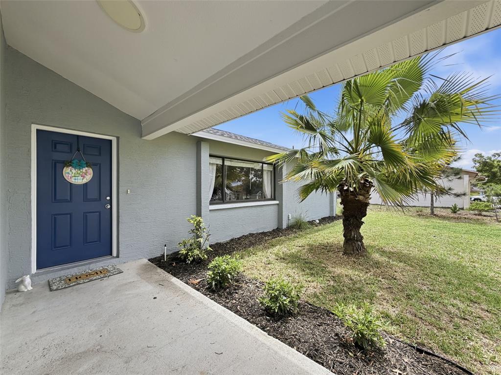 5384 Baldock Avenue Spring Hill, FL 34608 - Photo 11 of 51 a house with a garden in front of it