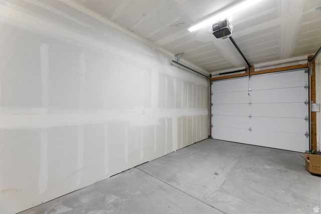 14392 South Champ Cove Draper, UT 84020 - Photo 30 of 31 Garage featuring a garage door opener