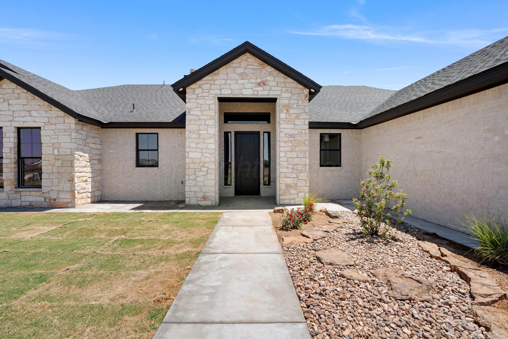4201 Juniper Springs Road Amarillo, TX 79119 - Photo 1 of 27 a front view of a house with a yard
