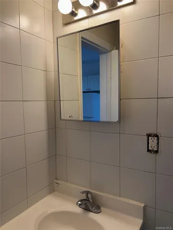 a bathroom with a sink and vanity