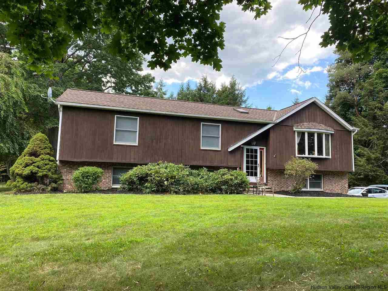 136 South Riverside Road Highland, NY 12528 - Photo 1 of 23 a front view of a house with a yard