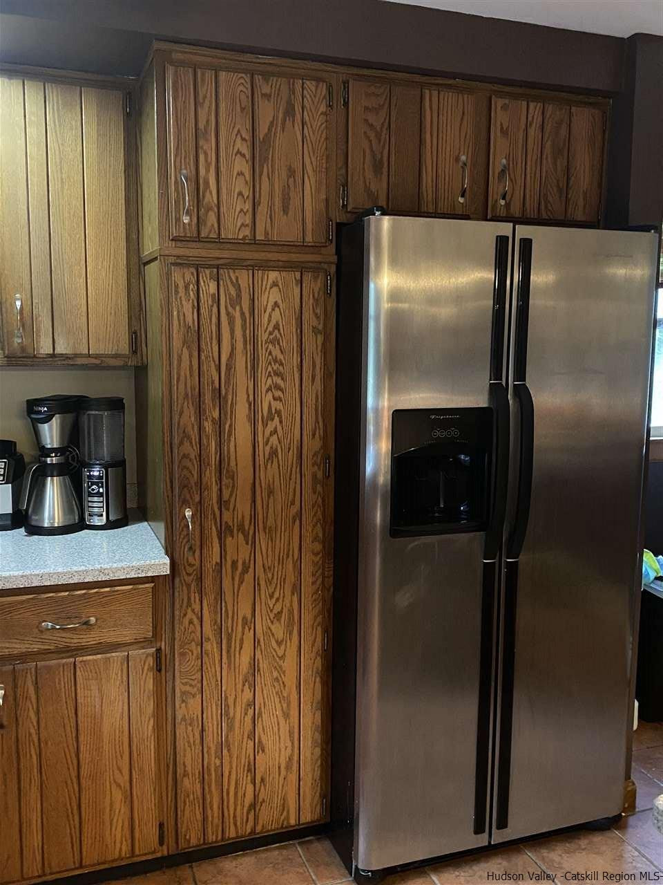 136 South Riverside Road Highland, NY 12528 - Photo 3 of 23 a kitchen with metallic refrigerator freezer and a dishwasher