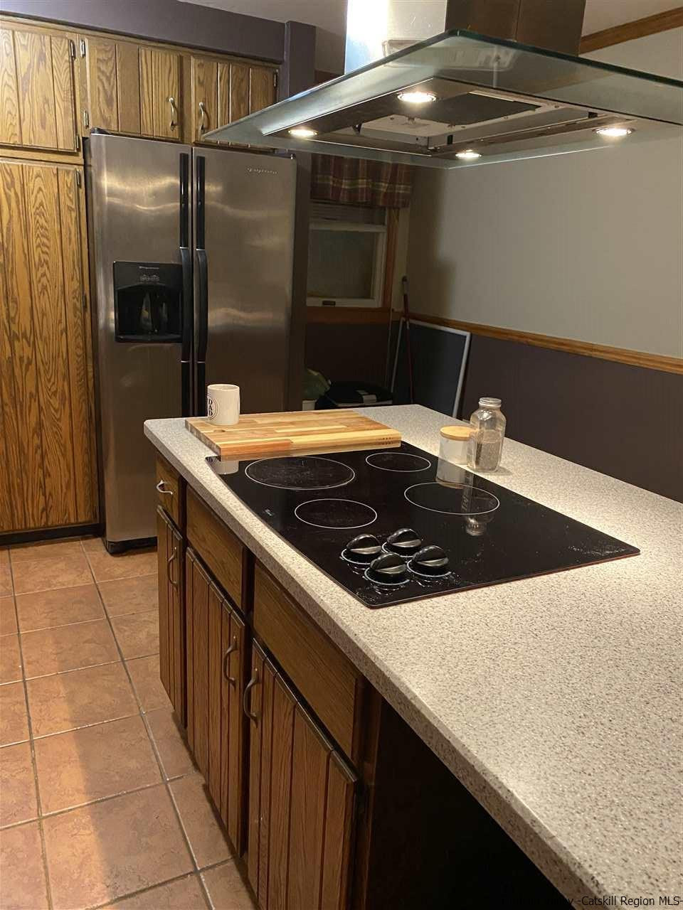 136 South Riverside Road Highland, NY 12528 - Photo 5 of 23 a kitchen with stainless steel appliances granite countertop a sink a stove and a refrigerator