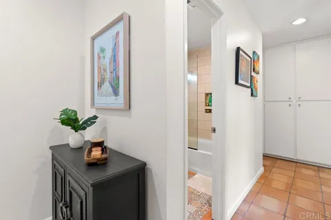 a bathroom with a sink toilet vanity and shower