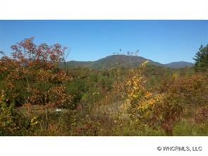 a open area with mountains in the background
