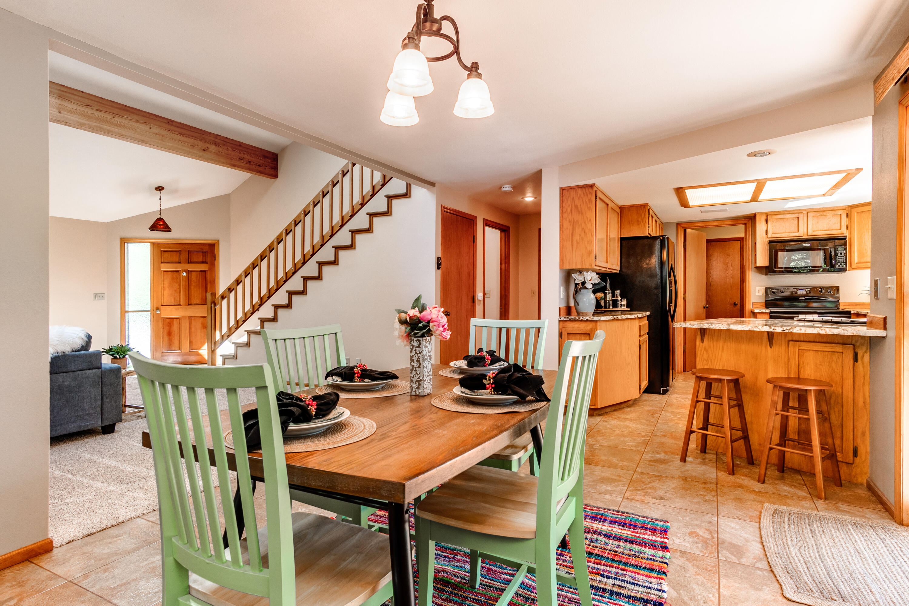 63536 Vogt Road Bend, OR 97701 - Photo 11 of 44 a dining room with furniture and wooden floor