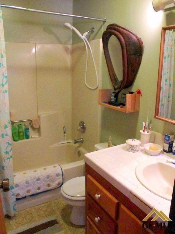 Undisclosed Address Caliente, CA 93518 - Photo 14 of 14 a bathroom with a sink toilet and shower