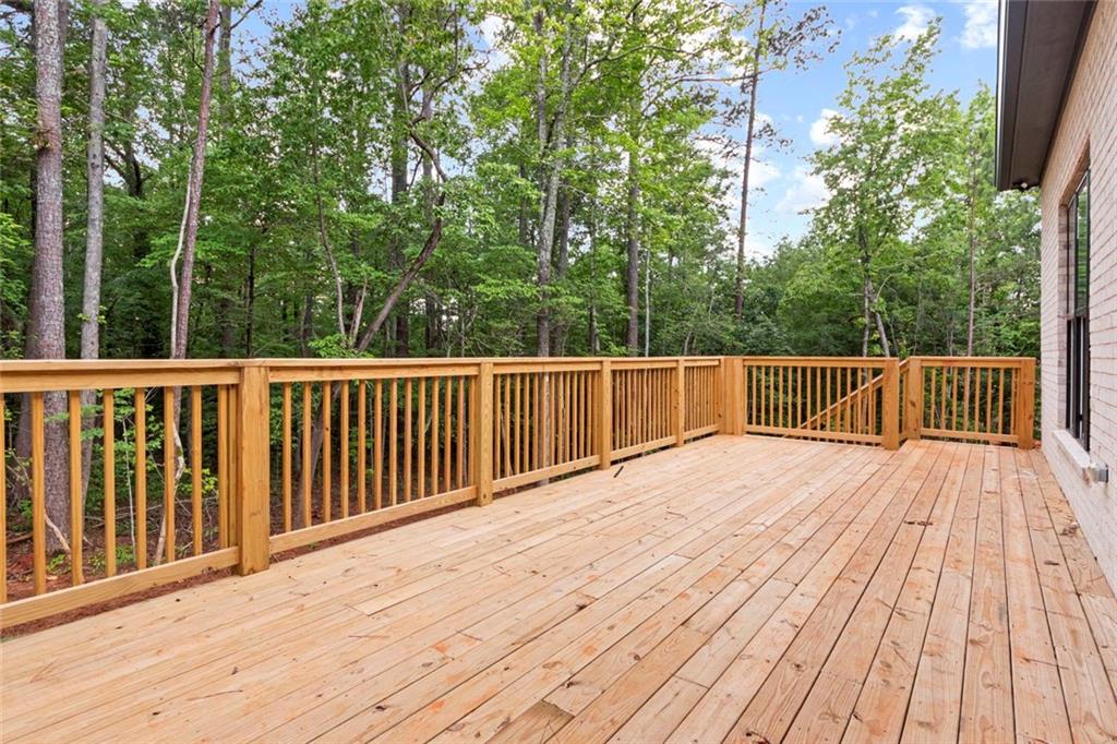 7066 Bells Way Fairburn, GA 30213 - Photo 62 of 64 a view of deck with wooden floor and fence
