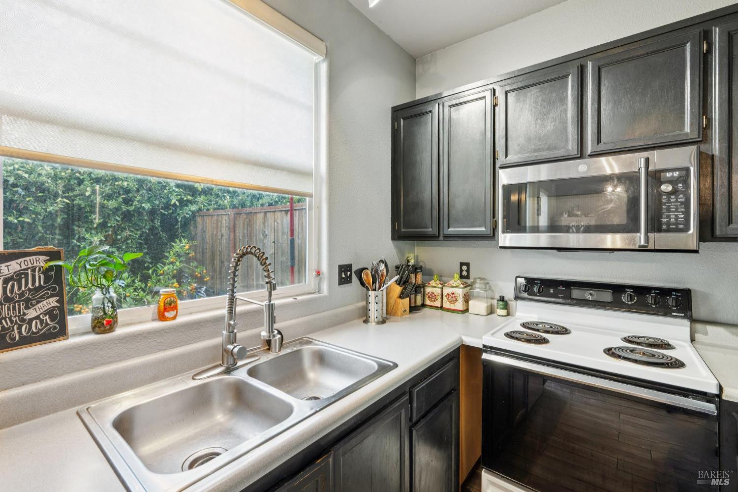 1507 Pinebrook Place Santa Rosa, CA 95403 - Photo 7 of 15 a kitchen with a stove a sink and a microwave