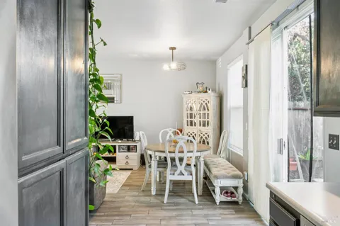 a view of a dining room with furniture window and wooden floor