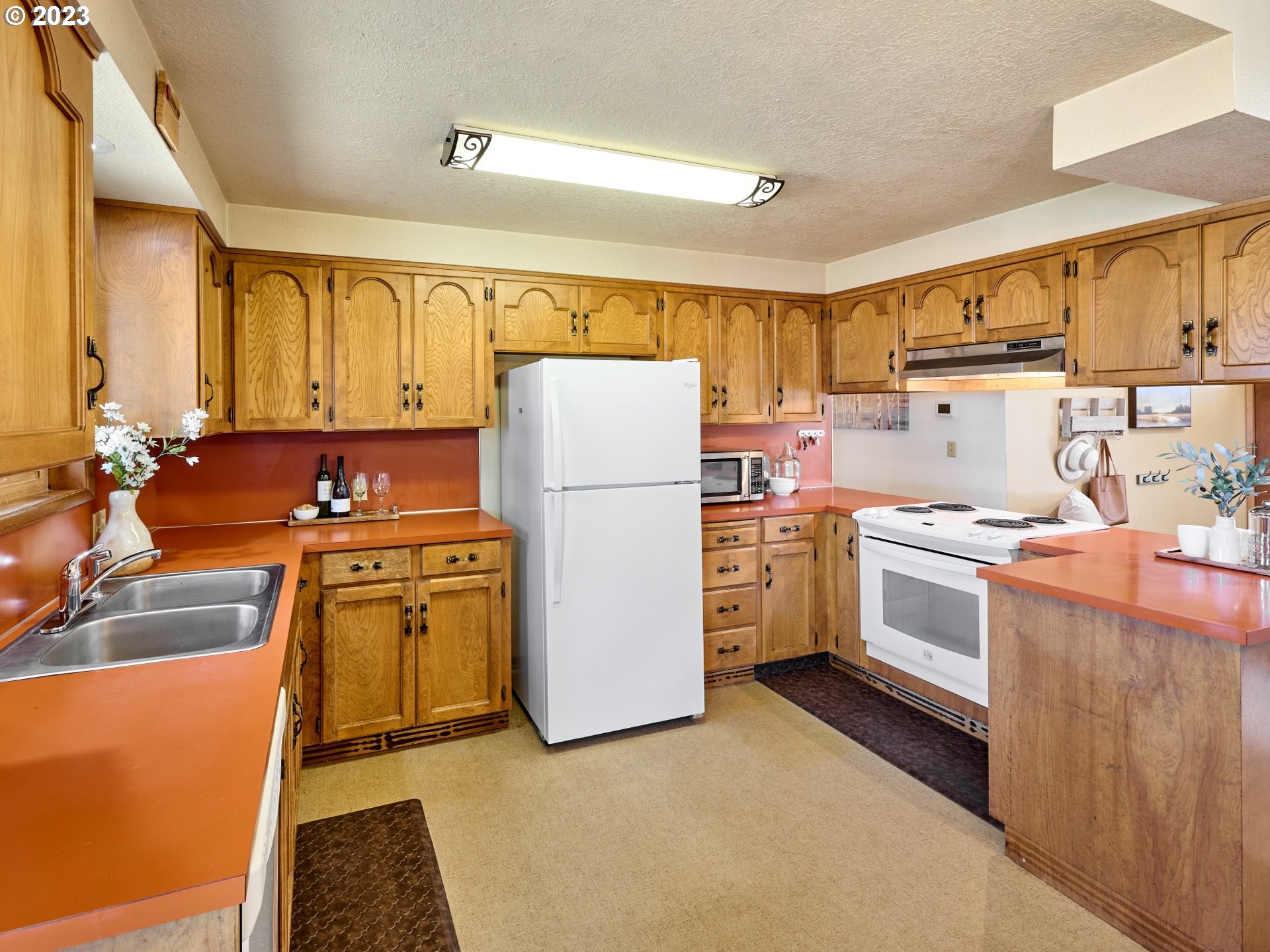 3661 Seminole Road Northeast Silverton, OR 97381 - Photo 13 of 48 a kitchen with stainless steel appliances a refrigerator sink and cabinets