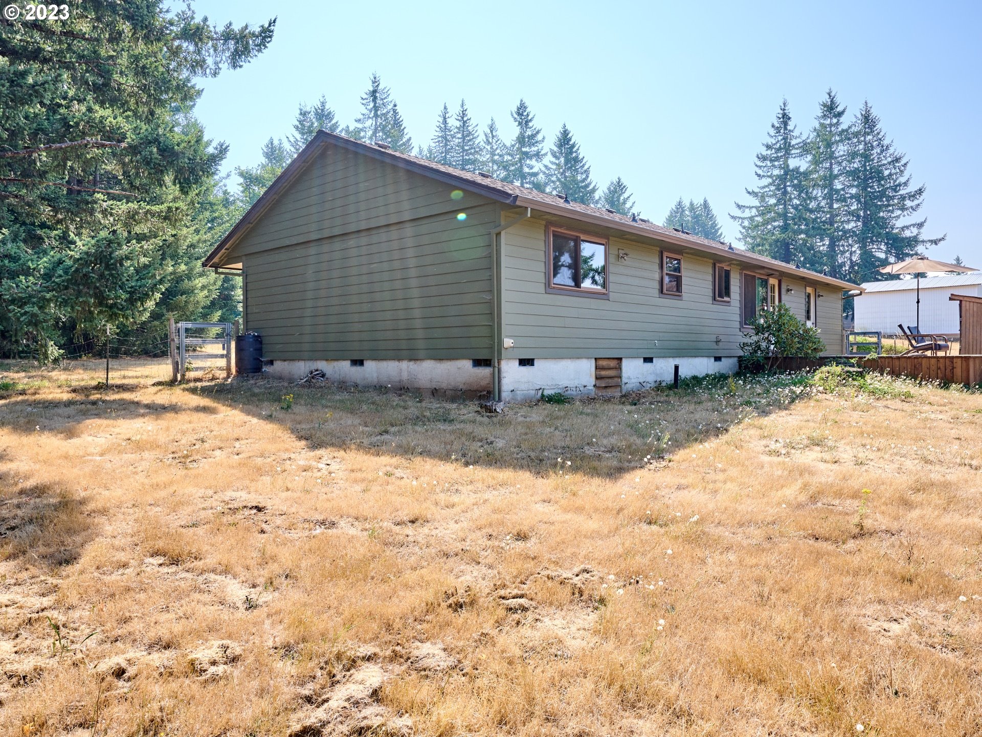 3661 Seminole Road Northeast Silverton, OR 97381 - Photo 31 of 48 a front view of house with yard and trees in the background