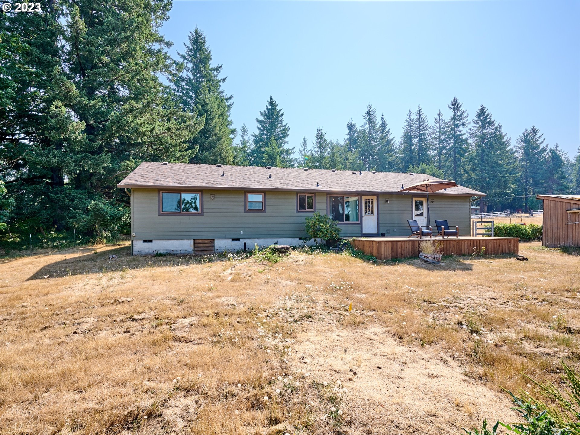 3661 Seminole Road Northeast Silverton, OR 97381 - Photo 32 of 48 a view of a house with a yard covered in snow