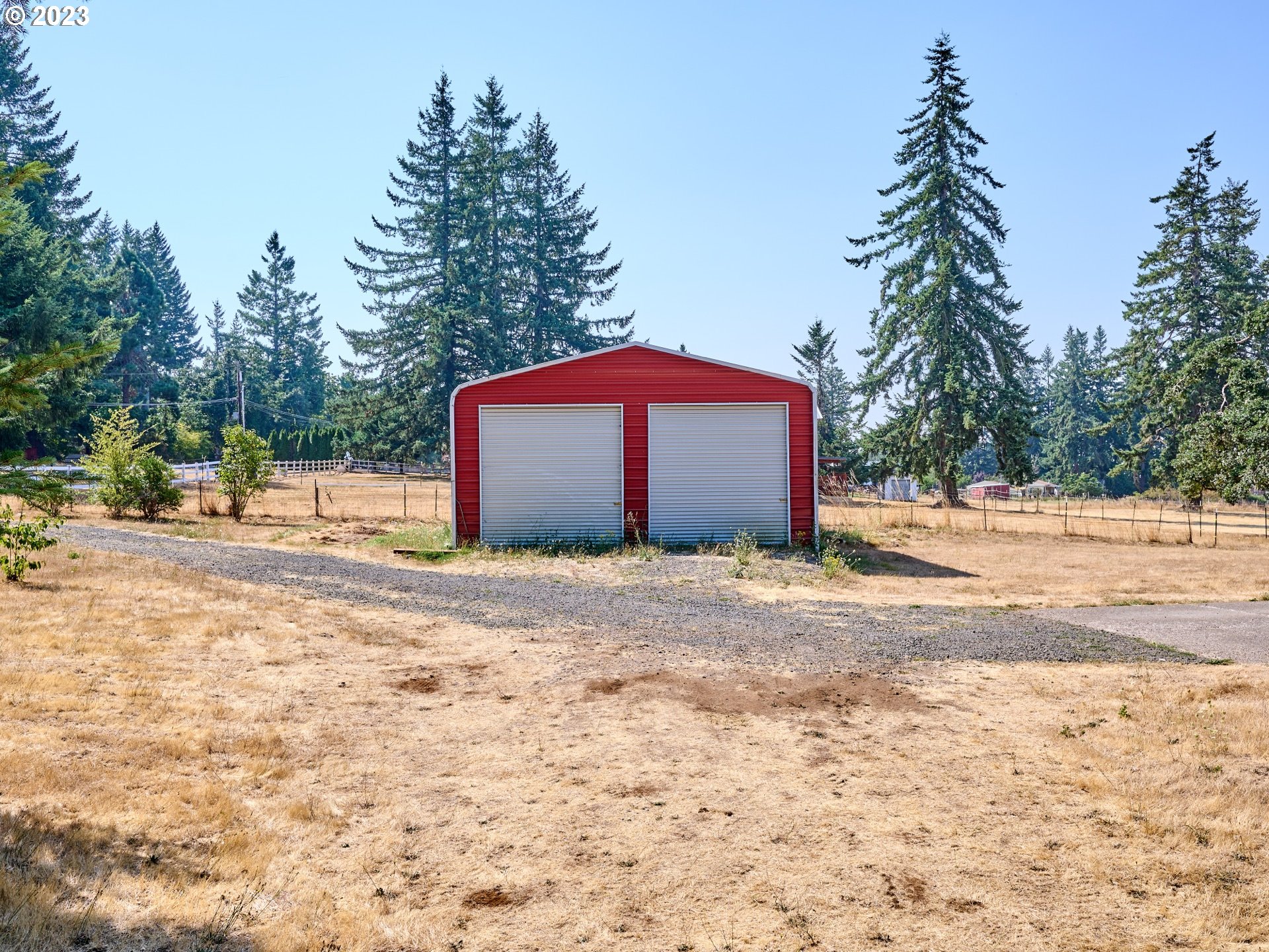 3661 Seminole Road Northeast Silverton, OR 97381 - Photo 36 of 48 a house with trees next to a yard