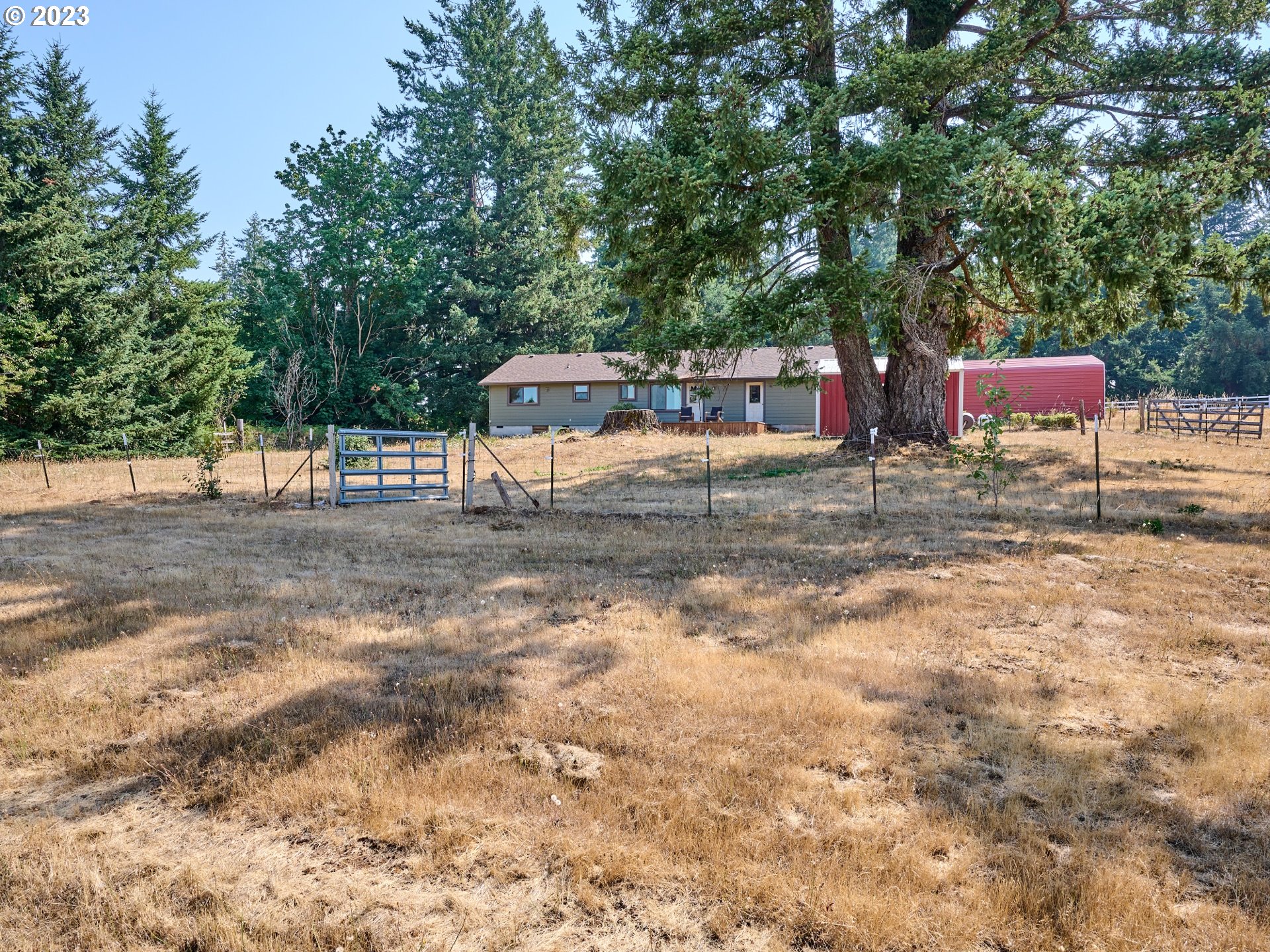 3661 Seminole Road Northeast Silverton, OR 97381 - Photo 45 of 48 a backyard of a house with table and chairs