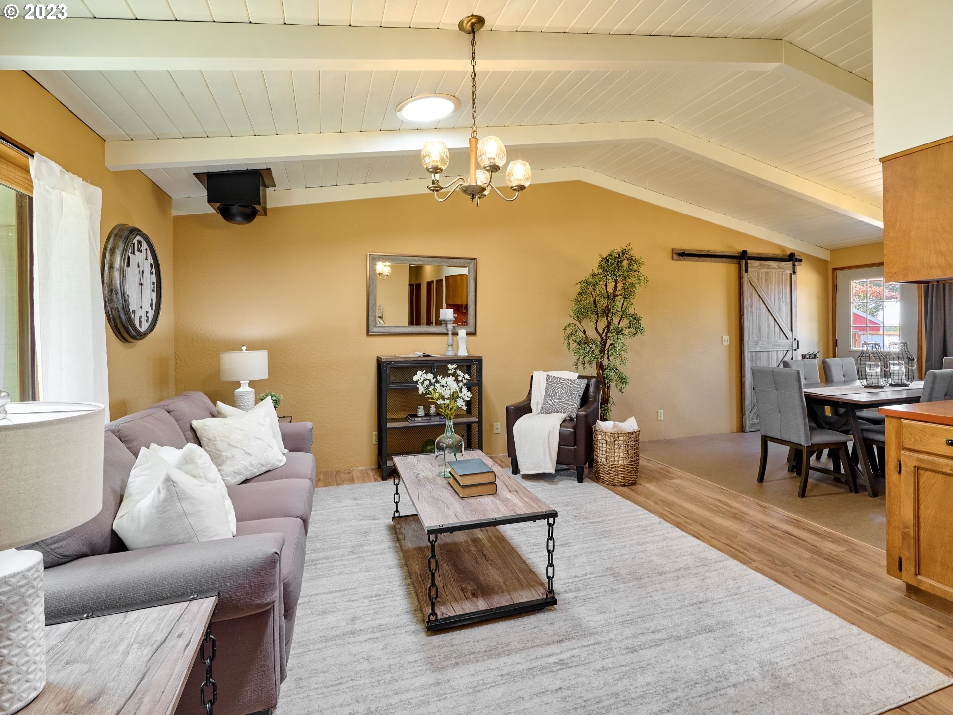 3661 Seminole Road Northeast Silverton, OR 97381 - Photo 6 of 48 a living room with furniture and a chandelier