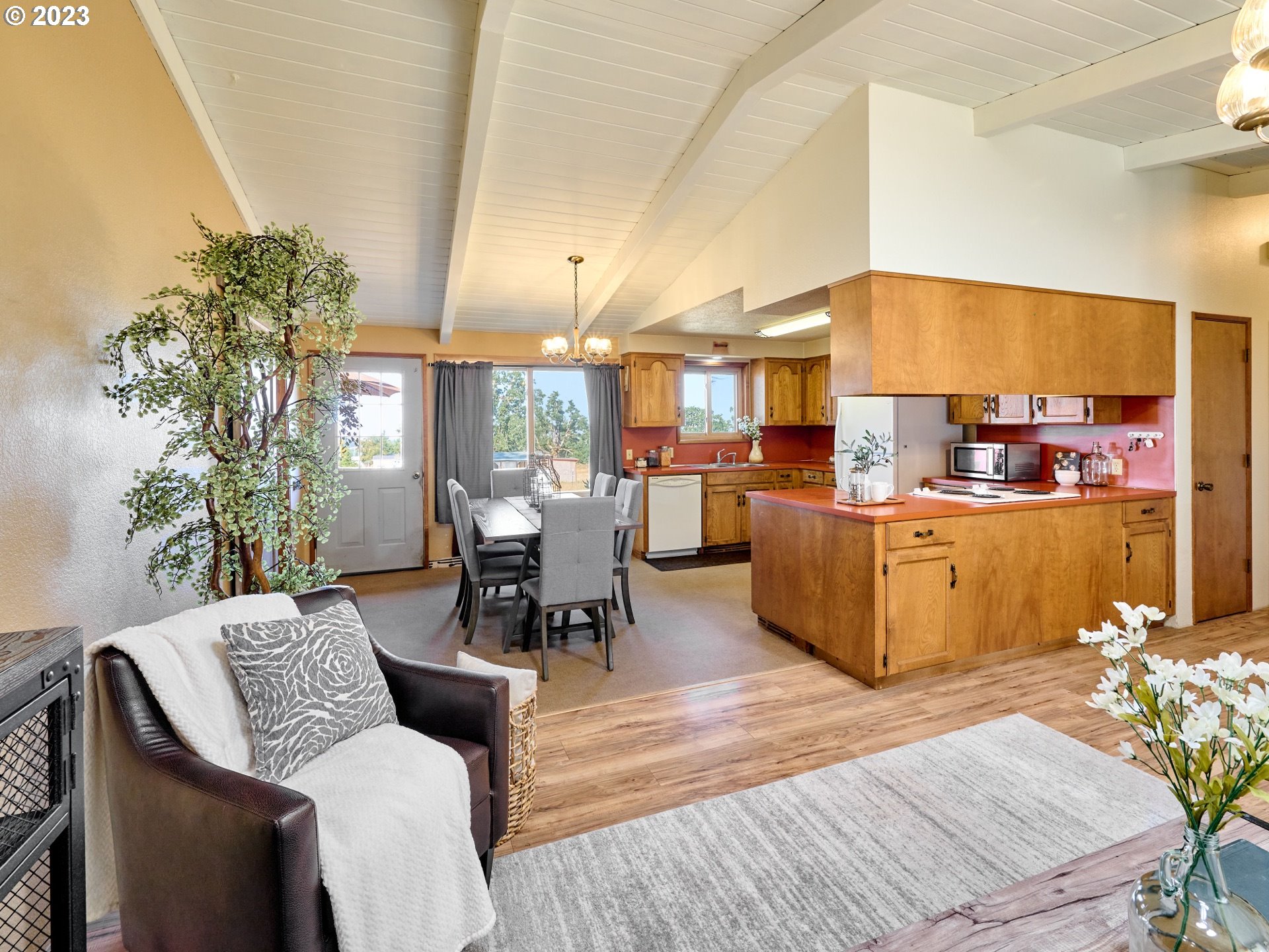 3661 Seminole Road Northeast Silverton, OR 97381 - Photo 7 of 48 a living room with furniture kitchen view and a potted plant