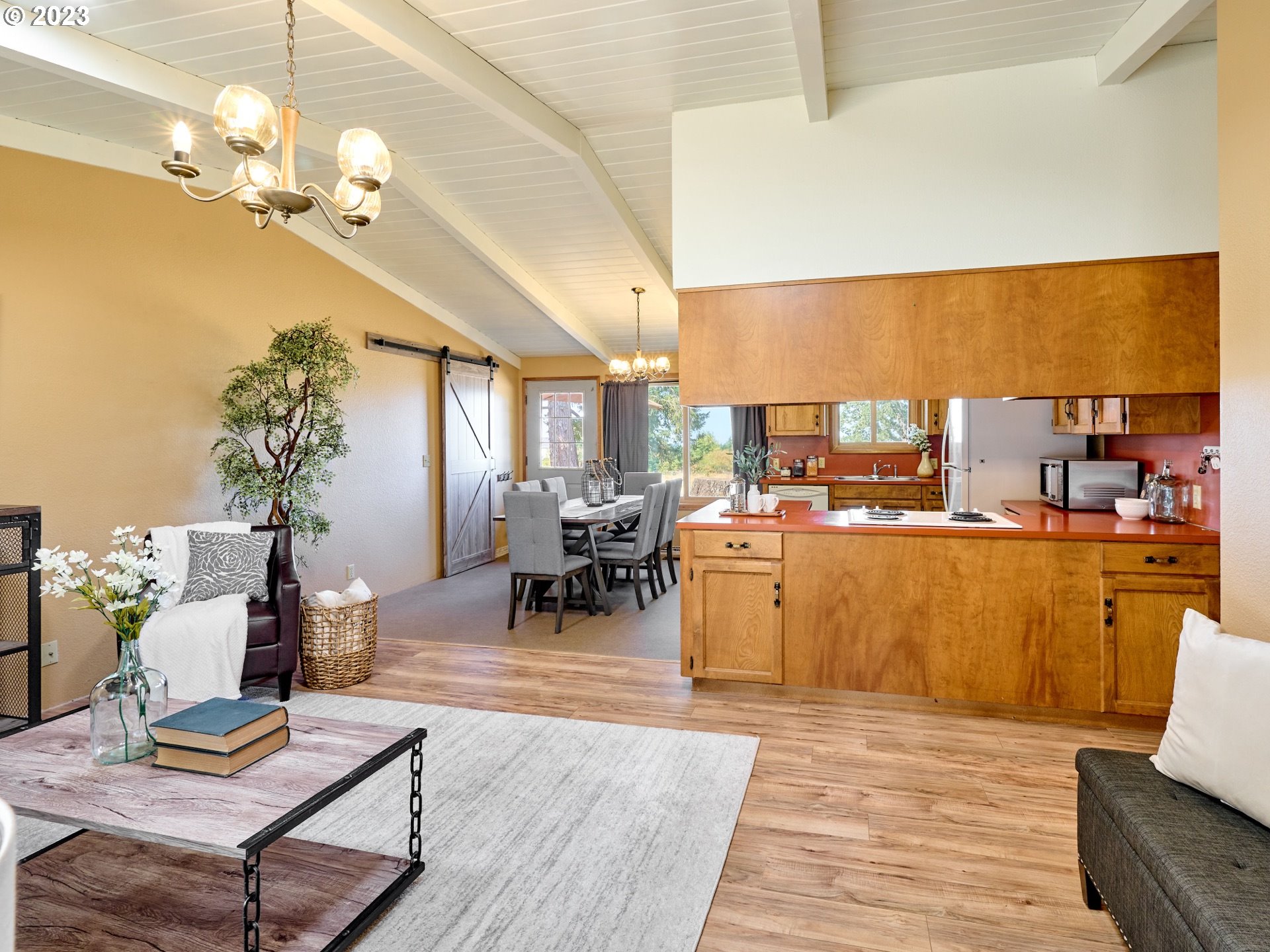 3661 Seminole Road Northeast Silverton, OR 97381 - Photo 8 of 48 a living room with lots of furniture and kitchen view
