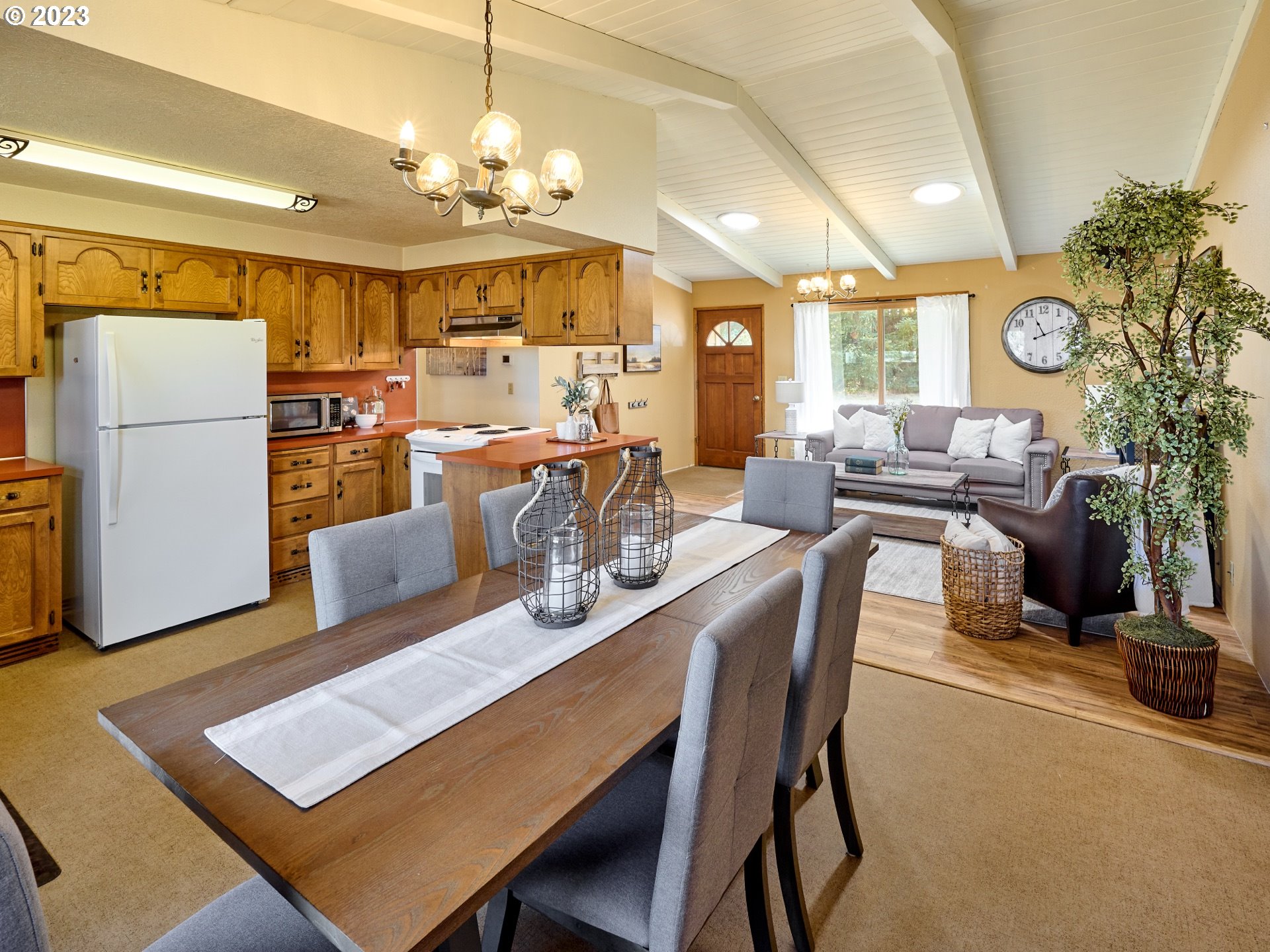 3661 Seminole Road Northeast Silverton, OR 97381 - Photo 10 of 48 a view of a dining room with furniture and a chandelier
