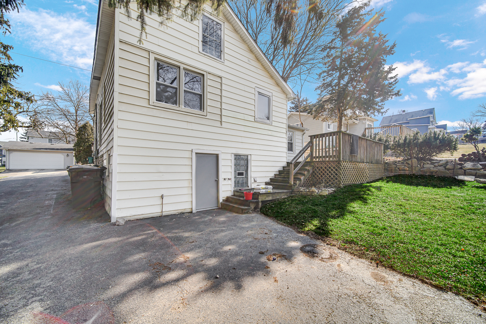 716 Chestnut Street Lemont, IL 60439 - Photo 18 of 20 a view of a house with a yard and garage