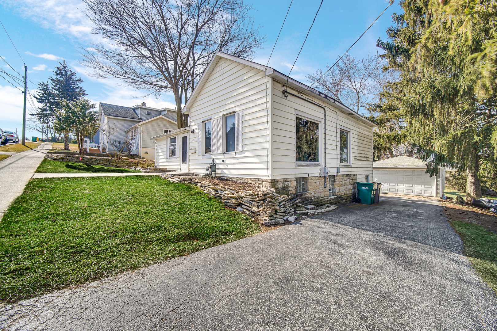 716 Chestnut Street Lemont, IL 60439 - Photo 2 of 20 a front view of a house with a yard and garage