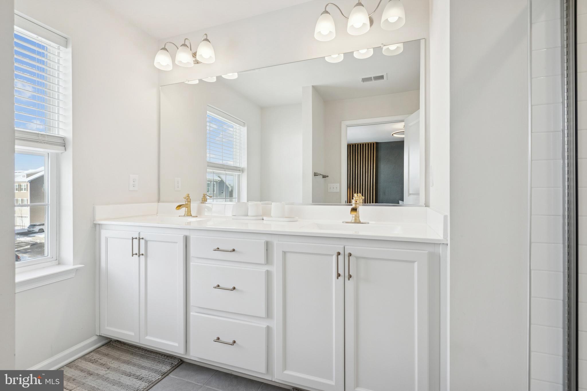 12 Palermo Ln Mount Mount Laurel, NJ 08054 - Photo 11 of 25 a bathroom with a double vanity sink and a mirror
