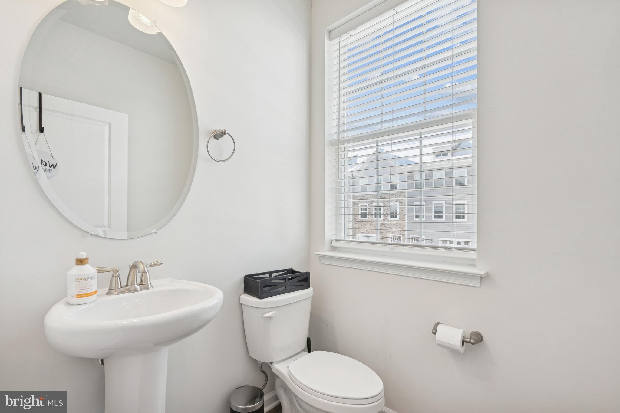 12 Palermo Ln Mount Mount Laurel, NJ 08054 - Photo 18 of 25 a bathroom with a toilet a sink and mirror