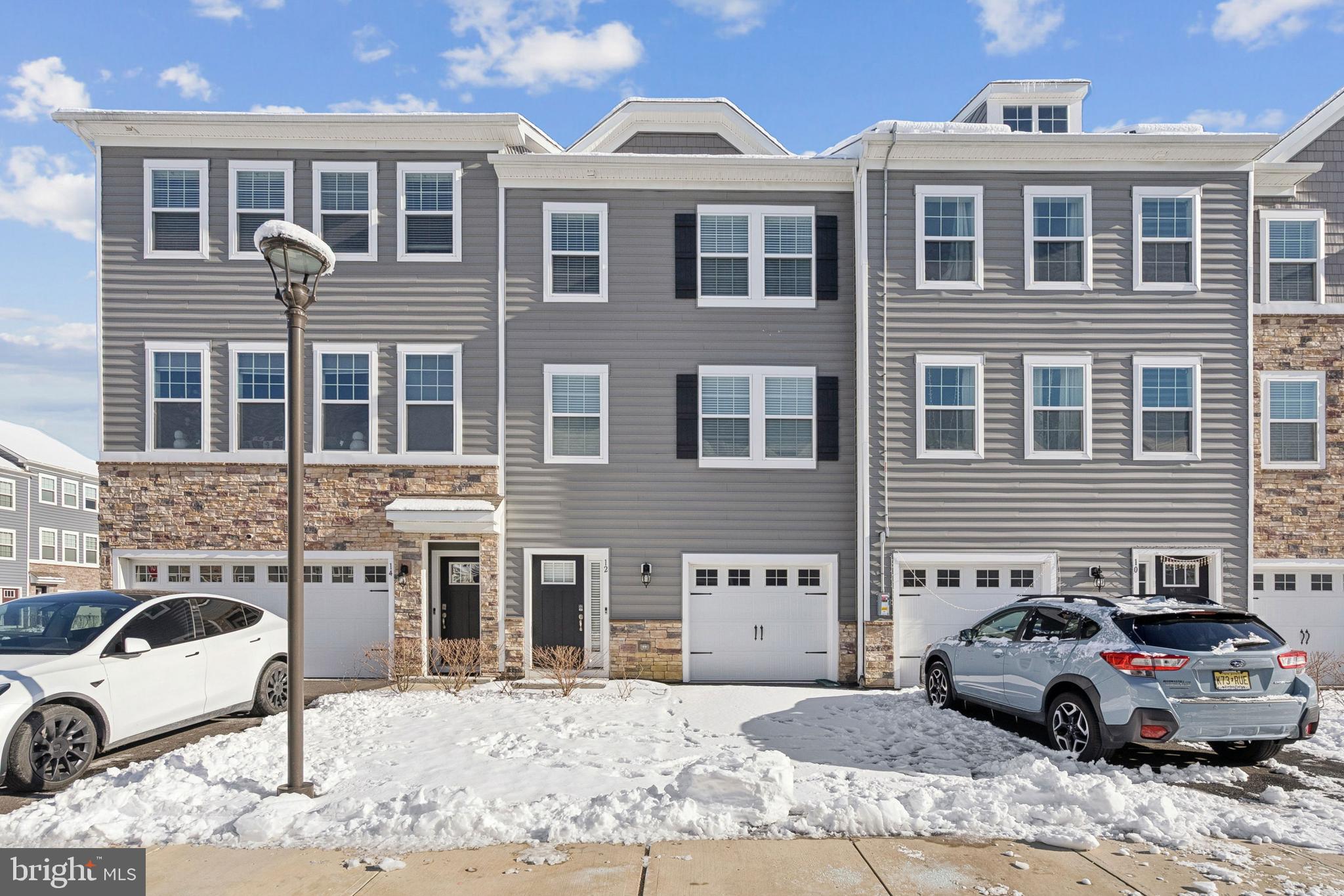 12 Palermo Ln Mount Mount Laurel, NJ 08054 - Photo 2 of 25 a front view of a house with a yard