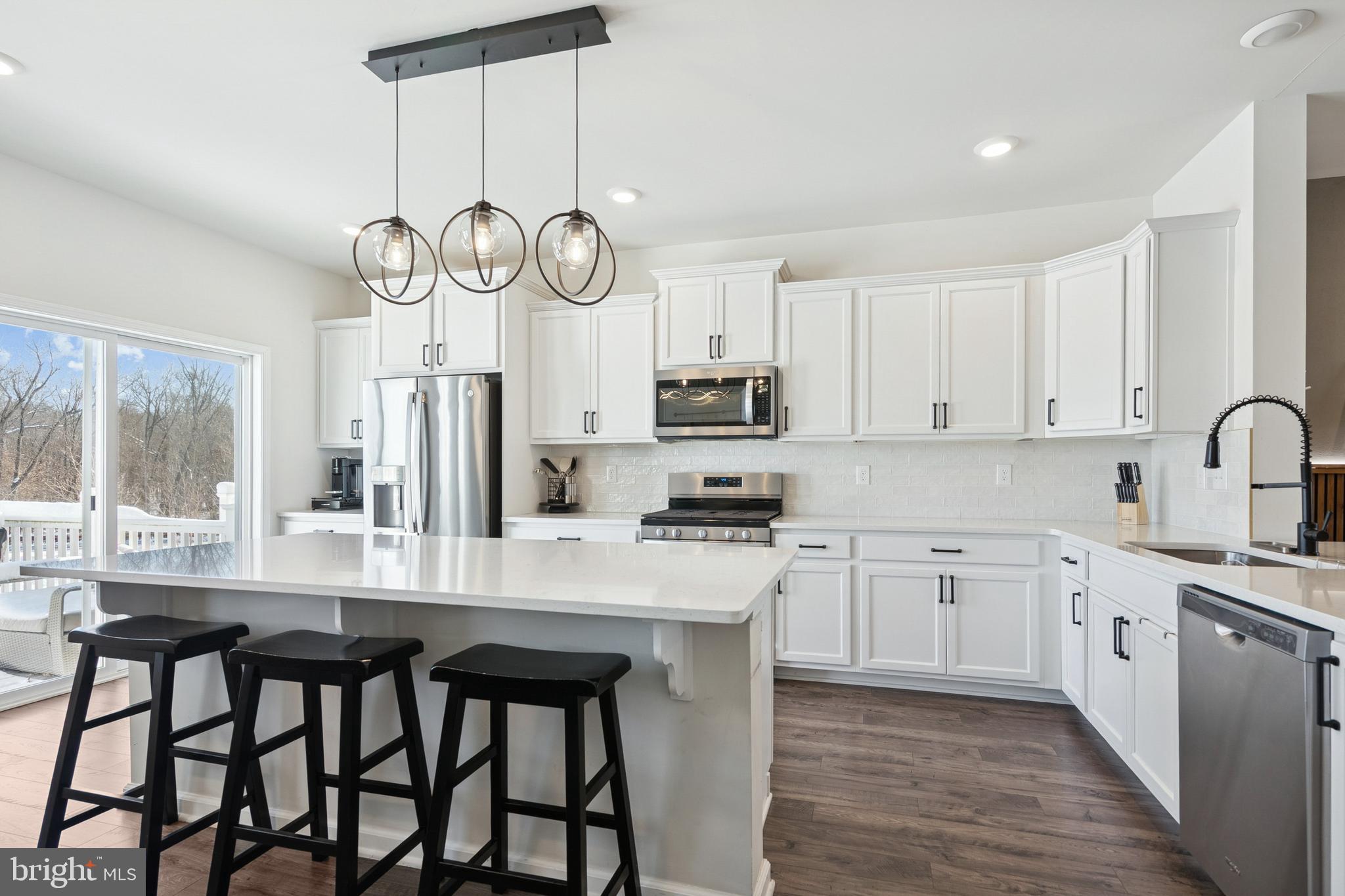 12 Palermo Ln Mount Mount Laurel, NJ 08054 - Photo 4 of 25 a kitchen with a table chairs cabinets a stove and a window