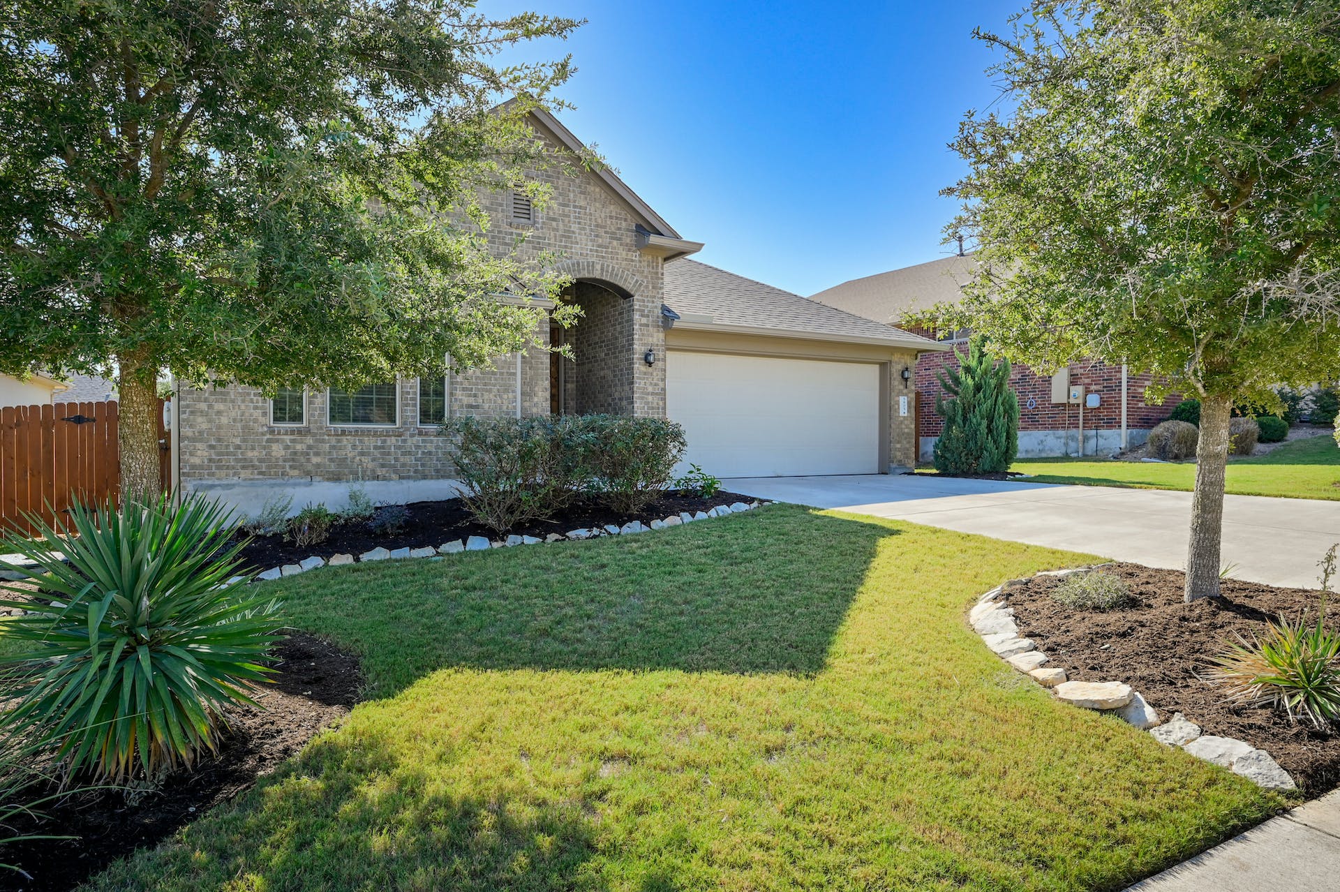 5805 Buchanan Draw Road Austin, TX 78738 - Photo 3 of 39 a front view of a house with garden