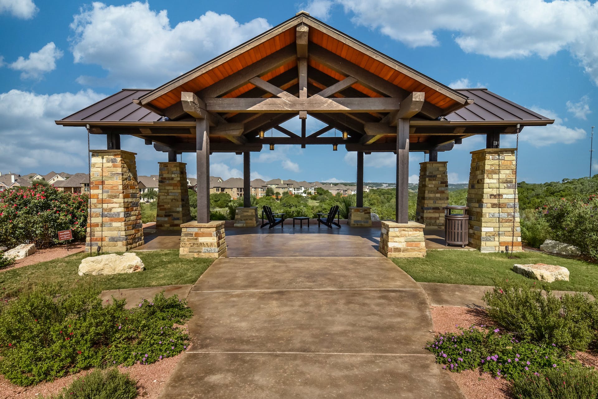 5805 Buchanan Draw Road Austin, TX 78738 - Photo 31 of 39 a view of a patio with table and chairs under an umbrella