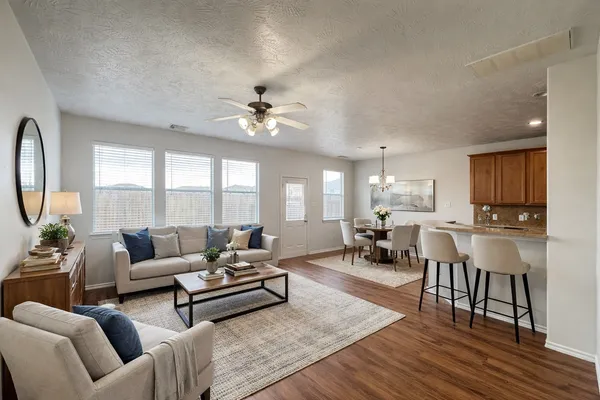 a living room with furniture and a large window